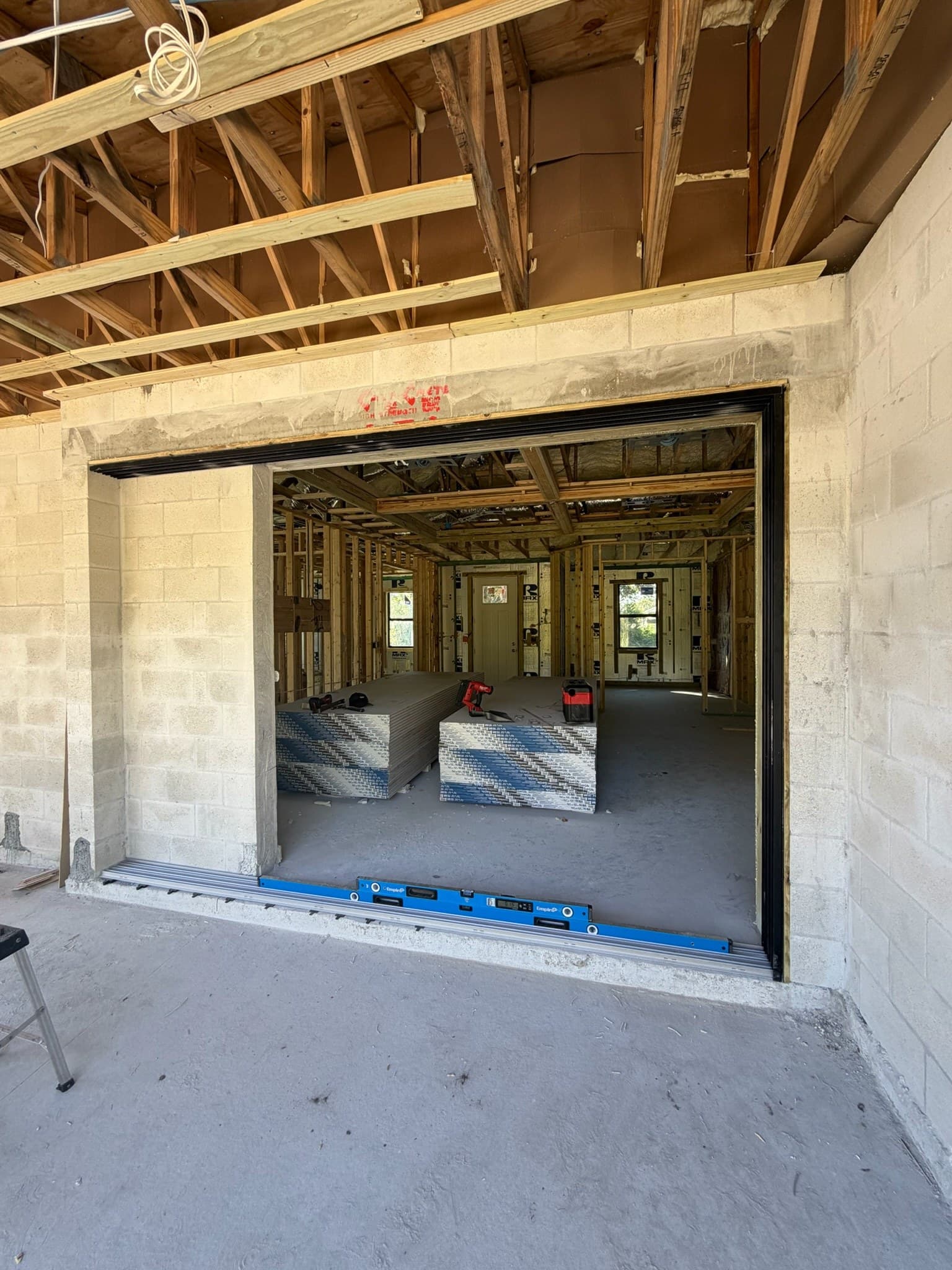 A rough opening squared and leveled mid-construction, ready for a window or door