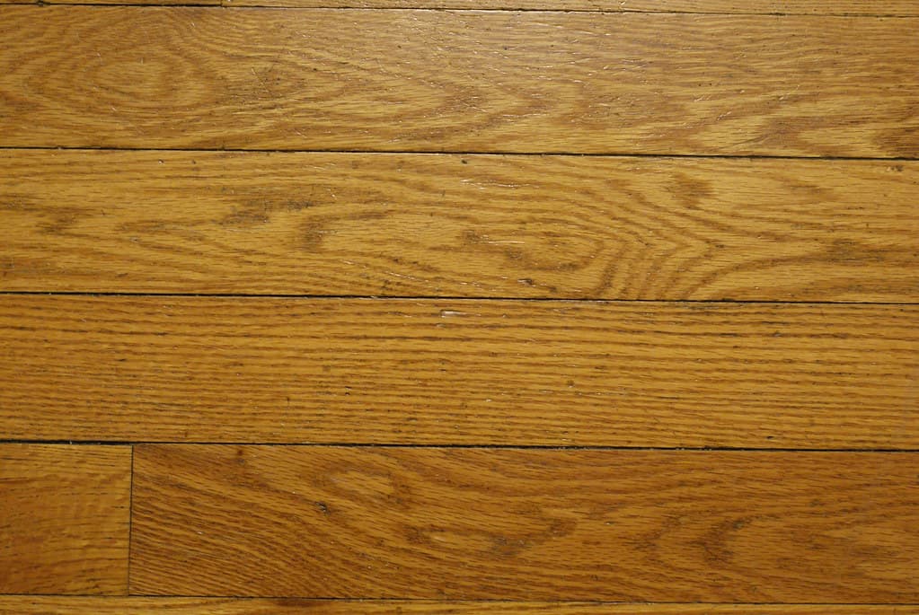 Close-up of worn hardwood flooring grain